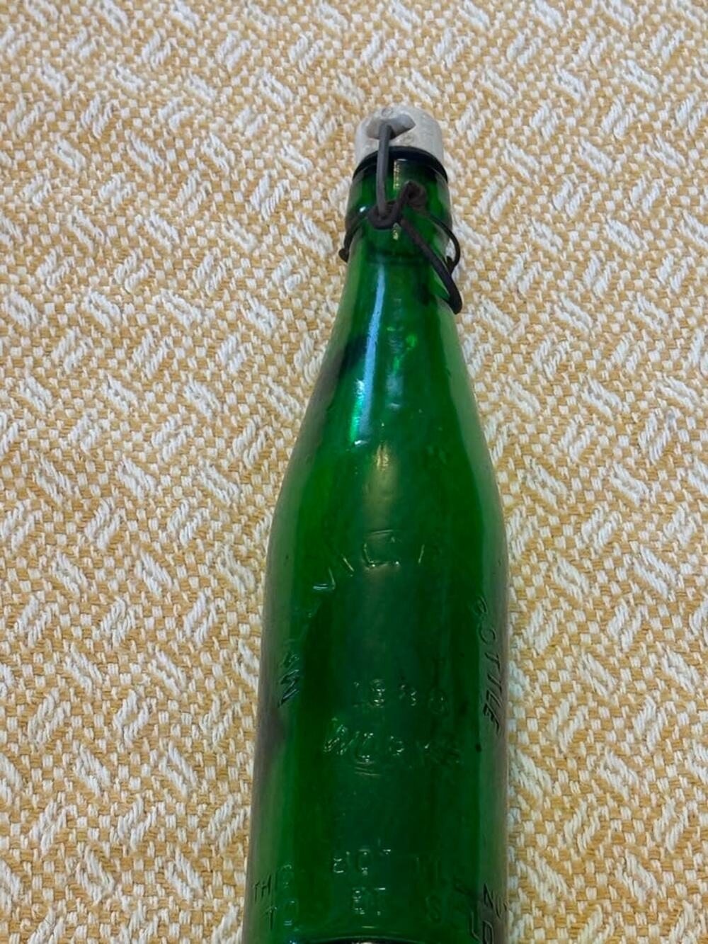Vintage green glass swing-top bottle